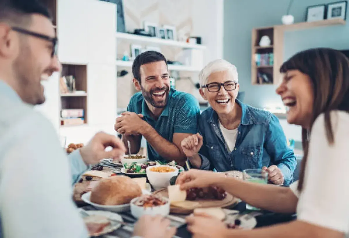 Family reconnecting through cooking and conversation.