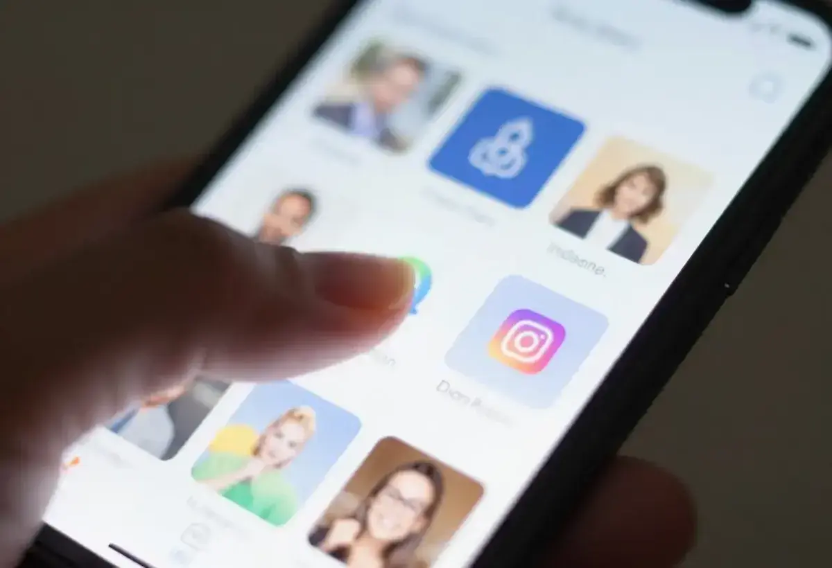 Hand continuously scrolling through social media feed