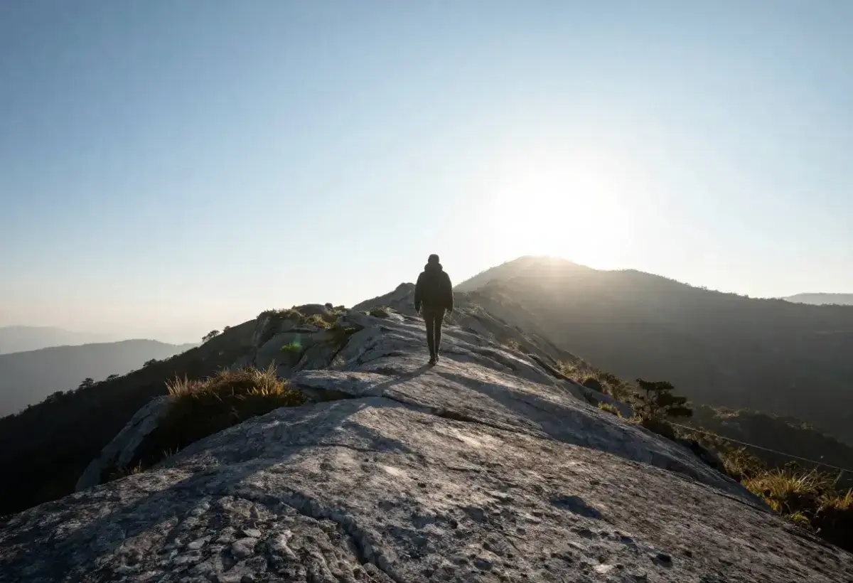 Person walking at sunrise reflecting on life purpose and burnout recovery