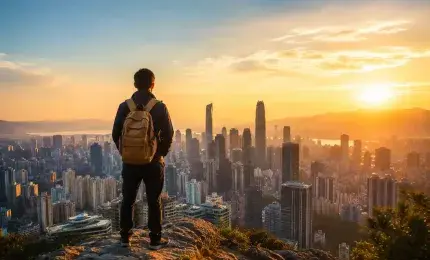 A lone traveler looking toward a distant city skyline at sunrise